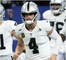  ?? Ap file ?? CASHING IN: Las Vegas Raiders quarterbac­k Derek Carr agreed to a three-year, $121.5 million extension last week.