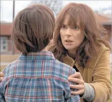  ??  ?? JOYCE BYERS (Winona Ryder) confronts Dustin Henderson (Matarazzo) in another scene from the Netf lix series.