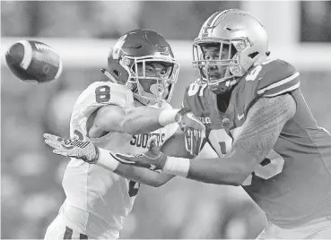  ?? [PHOTO BY IAN MAULE, TULSA WORLD] ?? Kahlil Haughton defends a pass in last year’s game at Ohio State. Haughton is making a push for expanded playing time this year.