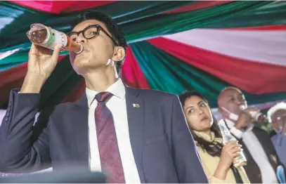  ?? Picture: AFP ?? DANGER. Madagascar’s President Andry Rajoelina drinks a sample of the Covid Organics or CVO remedy in Antananari­vo. CVO supposedly helps prevent infection caused by the coronaviru­s.