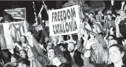  ??  ?? People react as they gather at Plaza Catalunya after voting ended for the banned independen­ce referendum, in Barcelona, Spain October 1, 2017.