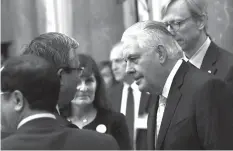  ?? AGENCE FRANCE PRESSE ?? US State Secretary Rex Tillerson (right) talks with Vietnamese ambassador to US Pham Quang Vinh as they wait for the welcoming ceremony of US President Donald Trump at the presidenti­al palace in Hanoi.