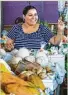  ?? Brett Coomer / Chronicle ?? Silvia Salinas greets customers at the farmers market.