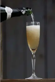  ?? HILLARY LEVIN — ST. LOUIS POST-DISPATCH/ TNS ?? Winter is the time to try warming cocktails like this cognac French 75.