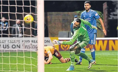  ?? Picture: SNS. ?? Joe Lewis looks on as Motherwell’s Louis Moult scores to make it 1-0.