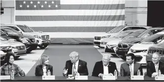  ?? Reuters-Yonhap ?? U.S. President Donald Trump talks with auto industry leaders, including General Motors CEO Mary Barra, second from left, and United Auto Workers President Dennis Williams, 4th from left, at the American Center for Mobility in Ypsilanti Township, Mich....