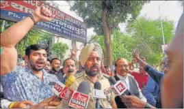  ?? PTI ?? Punjab Police DSP (detective) KS Sandhu speaks to the media during BJP workers’ protest against arrest of party spokespers­on Tajinder Bagga, at Janakpuri police station, in New Delhi on Friday.