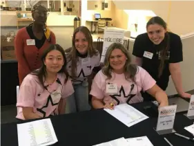  ?? ?? Jameelah Platt, left, Sissi Hai, Kira Hutton, Flying Scooter Production­s marketing manager Jenna Bunk and Amy Remes help out during last month’s Rolodex networking event on Point Park’s Downtown campus.