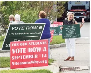  ?? Arnold Gold / Hearst Connecticu­t Media ?? Campaign volunteer Danielle Butti, right, waves to voters as they arrive at the Guilford Fire Department to vote in the Republican primary for the Board of Education on Sept. 14 in Guilford. Butti is the daughter of candidate Jim O’Keefe.