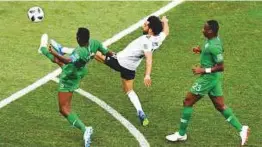  ?? AFP ?? Egypt’s Mohammad Salah lobs the ball to score their only goal against Saudi Arabia at the Volgograd Arena yesterday.