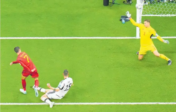  ?? Photo / AP ?? Spain’s Alvaro Morato scores the opening goal against Germany.