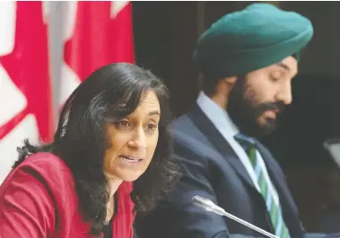  ?? ADRIAN WYLD / THE CANADIAN PRESS ?? Public Services and Procuremen­t Minister Anita Anand, left, says the government has placed orders from a variety of different companies for 157 million surgical masks, 60 million N95 masks and 1,570 ventilator­s.