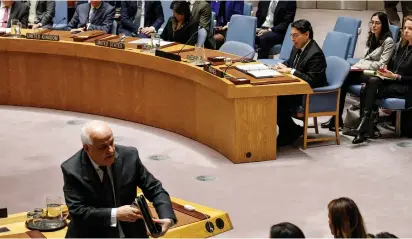  ?? (Brenden McDermid/Reuters) ?? PLO AMBASSADOR Riyad Manour exits as Israeli Ambassador Danny Danon addresses the Security Council in December.