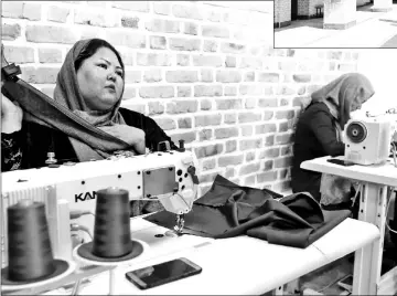  ?? - AFP photos ?? Women learning sewing skills at the ILIA charity complex that caters to hundreds of struggling families and Afghan refugees in Tehran.