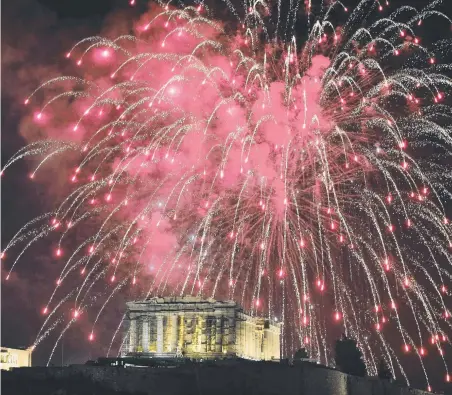  ?? Picture: AFP ?? A shower of fireworks explodes over the Acropolis in Athens as part of New Year celebratio­ns.