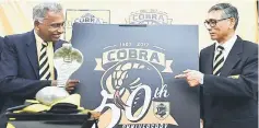  ??  ?? Cobra Rugby Club president Tommy Pereire and organising chairman Tan Sri Krishnan Tan (right) pose with the club’s new logo during a press conference. — Bernama photo