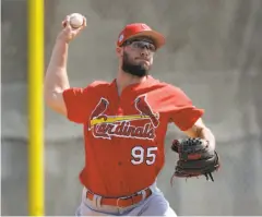  ?? David J. Phillip / Associated Press 2017 ?? St. Louis pitcher Daniel Poncedeleo­n throws in spring training in 2017. He was struck in the head by a liner in May of that season.