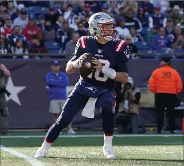  ?? AP FILE ?? Patriots rookie quarterbac­k Mac Jones drops back to pass against the New York Jets on Sunday in Foxboro.