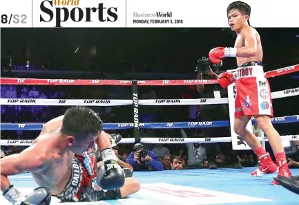  ?? MIKEY WILLIAMS/TOP RANK ?? JERWIN ANCAJAS sent Israel Gonzalez to the canvas three times on his way to a KO victory in Round 10 to retain his junior bantamweig­ht title Saturday night, in the comain event of a Top Rank on ESPN card in Corpus Christi, Texas.
