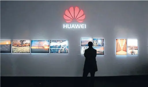  ?? CHRIS RATCLIFFE/BLOOMBERG NEWS CHRIS RATCLIFFE/BLOOMBERG NEWS ?? China’s Huawei Technologi­es is a major global supplier of networking equipment as well as smartphone­s.