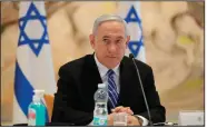  ??  ?? Israeli Prime Minister Benjamin Netanyahu attends the first Cabinet meeting of his new government Sunday in Jerusalem. His coalition deal includes a clause that allows him to present his annexation plan to the government in July.
(AP/Abir Sultan)