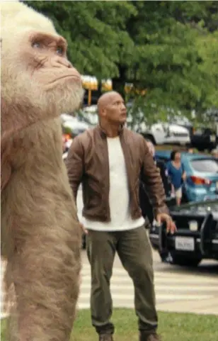  ??  ?? VIDEO ADAPTATION: Naomie Harris and Dwayne Johnson in a scene from the movie Rampage.