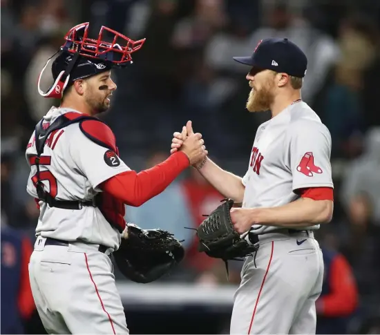  ?? Getty iMAges ?? CLOSING TIME: Jake Diekman, left, and Kevin Plawecki celebrate the Red Sox’ 4-3 win over the New York Yankees at Yankee Stadium on Sunday night.