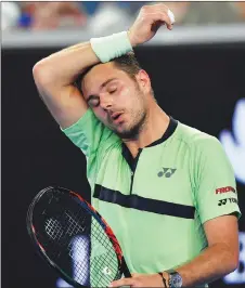  ?? AP PHOTO ?? Switzerlan­d’s Stan Wawrinka wipes the sweat from his face during his secondroun­d match at the Australian Open tennis championsh­ips, where temperatur­es soared to 40 C on Thursday.
