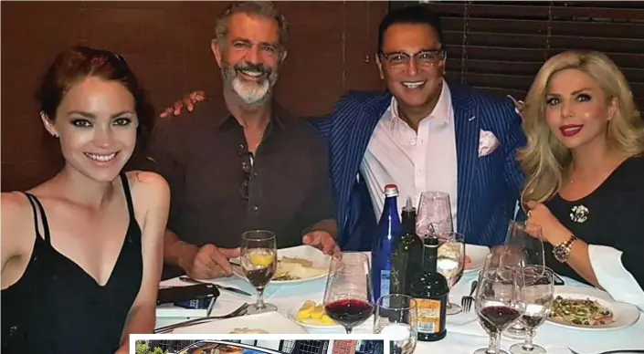  ??  ?? ‘Good friends’: Ali Dizaei put his arms round Mel Gibson as he and wife Shaham dine with the star and his girlfriend Rosalind