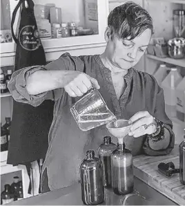  ?? DIANE DOIRON ?? Pamela Ibbitson is hard at work crafting the soaps she makes all on her own at Bee'n a Blossom.