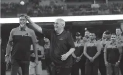  ?? JOE RONDONE/THE REPUBLIC ?? Longtime Diamondbac­ks radio announcer Greg Schulte, who announced that this season will be his last, throws out the first pitch before an Aug. 12 game against the San Diego Padres at Chase Field.