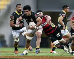  ?? PHOTOSPORT/GETTY IMAGES ?? Tsman players celebrate Alex Nankivell’s try in their hard-fought semifinal win over Auckland, left, while, right, DuPlessis Kirifi makes a typically lively charge in Wellington’s defeat of Canterbury.