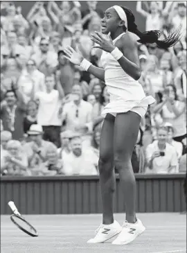  ?? Ben Curtis Associated Press ?? COCO GAUFF DROPS her racket after rallying to defeat Slovenia’s Polona Hercog in three sets on Centre Court. “I just feel relieved that it’s over,” she said.