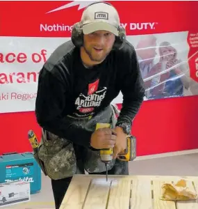  ??  ?? Sam Curran building the picnic table at the regional NZCB Apprentice Challenge.