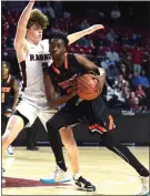  ?? PETE BANNAN - MEDIANEWS GROUP ?? Chester’s Kyree Womack drives with the ball against Radnor’s Michael Savadore last March, as Womack and the Clippers were driving toward a 66-65overtime win over the Raptors in the District 1Class 5A title game at Temple.