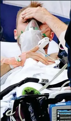  ??  ?? Denmark’s Christian Eriksen after receiving CPR on the pitch when his heart stopped during a Euros match yesterday