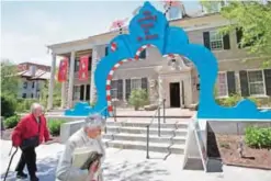  ??  ?? People walk near an entrance to The Amazing World of Dr Seuss Museum.