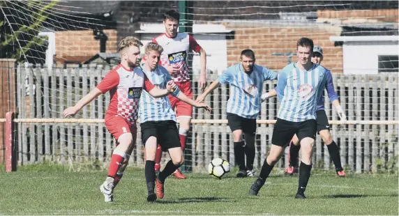  ??  ?? Ryhope Foresters (blue/white) in action against Redhouse at Ryhope Recreation Park, on Sunday morning. Pictures by Kevin Brady.