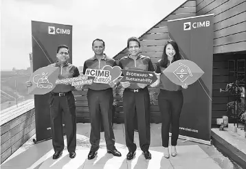  ??  ?? Samir (second right), Rafe (second left), CIMB Group regional head of cards, retail assets and deposits (group consumer banking) Vipin Agrawal (left) and head of retail assets and deposits (group consumer banking)Yong Kwai Ling (right) supporting CIMB’s lower financing rates for hybrid vehicles and Green Building Index-certified properties.