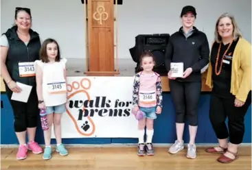  ??  ?? Walk for Prems Gippsland organiser Serena Arnold congratula­tes “Team Milly” on raising $232 including (from left) Sarah Egan, Grace Barton, Milly Barton and Jessica Harris.