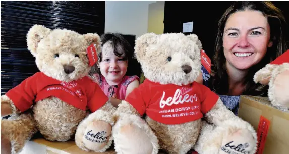  ??  ?? > Anna-Louise Bates, pictured with her daughter Elizabeth, set up the Believe charity after the death of her husband and son