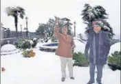  ?? ANI ?? Himachal Pradesh chief minister Jai Ram Thakur (right) with governor Rajendra Vishwanath Arlekar enjoy the snowfall in Shimla on Sunday.