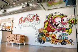  ?? PHOTOS CONTRIBUTE­D BY MIA YAKEL ?? Junior’s Pizza has several murals, including this pizza monster mural.