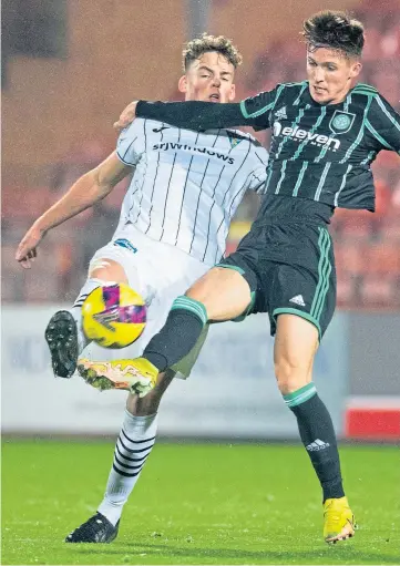  ?? ?? SCRAP: Dunfermlin­e’s Sam Young tackles Celtic B’s Johnny Kenny during last night’s SPFL Trust Trophy clash at East End Park.