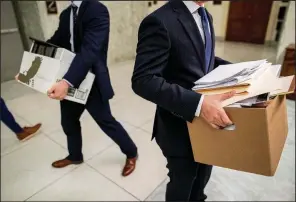  ?? AP/ANDREW HARNIK ?? Aides carry boxes of documents out of a House Judiciary Committee room Wednesday after a closed interview with former White House communicat­ions director Hope Hicks.