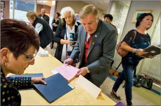  ?? Herald photo by Ian Martens @IMartensHe­rald ?? Mayor Chris Spearman lines up with the slate of other candidates Monday morning to file his nomination papers for the coming municipal election during nomination day at city hall.