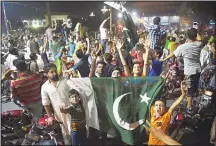  ?? (AFP) ?? Pakistani cricket fans celebrate winning the Internatio­nal Cricket Championsh­ip (ICC) Champions Trophy final cricket match against India
on June 18, in Lahore.