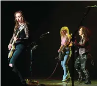 ?? The Associated Press ?? ■ Lead guitarist Bella Perron, from left, bassist Ashley Suppa, and singer-guitarist Moriah Formica, of the rock group Plush, perform on March 11 at the Tropicana casino in Atlantic City, N.J.