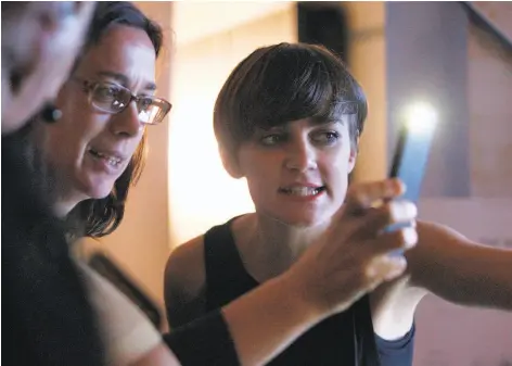  ?? Photos by Franchon Smith / The Chronicle ?? Livin Farms co-founder Katharina Unger speaks with a potential investor about edible mealworms grown in her company’s product.