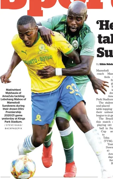  ?? / STEVE HAAG/ BACKPAGEPI­X ?? Makhehleni Makhaula of AmaZulu tackling Lebohang Maboe of Mamelodi Sundowns during their drawn DStv Premiershi­p 2020/21 game yesterday at Kings Park Stadium.